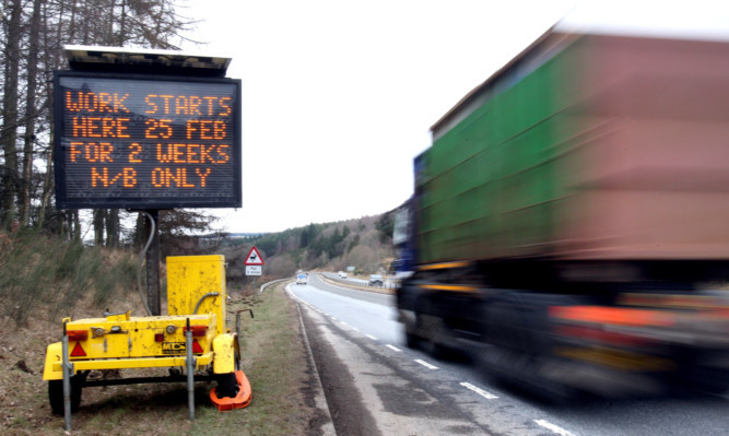 Kris Miller, Courier, 22/02/13. Picture today on the A9 north of Ballinluig shows a roadsign warning of upcoming roadworks.