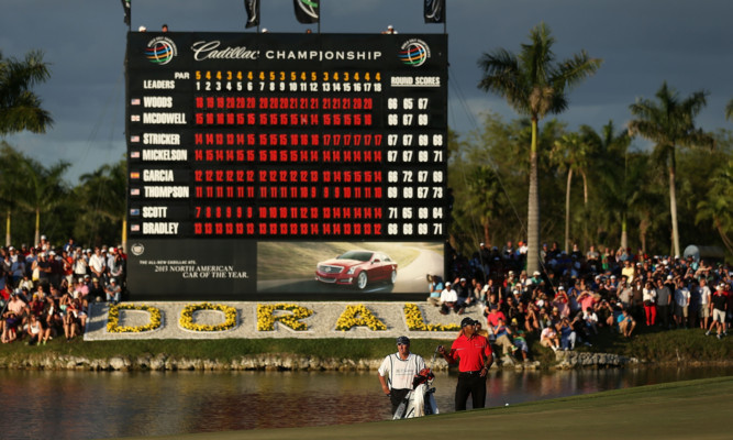 Tiger Woods' name back at the top of the leaderboard in Miami on Sunday.