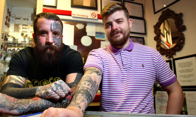 Jamie Shankland shows off his tattoo with artist Calum Stewart.