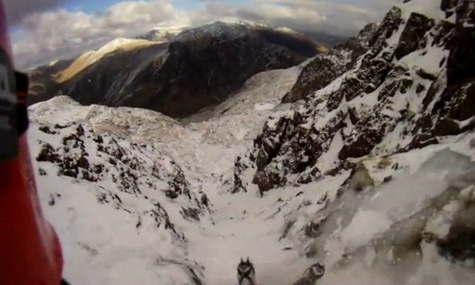 A still image from Mr Roberts' video showing him sliding down the mountainside.