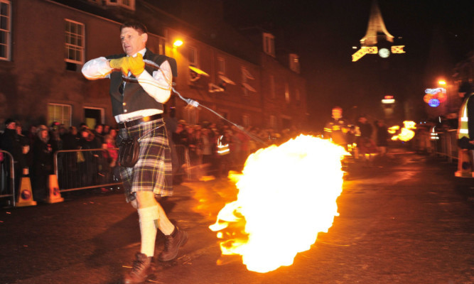 While large crowds are expected at the Stonehaven fireballs ceremony, organisers fear the poor ticket sales for the music event starring the Human League could jeopardise future events.