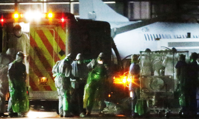 Pauline Cafferkey is transferred from an ambulance onto the plane that took her to London for treatment.