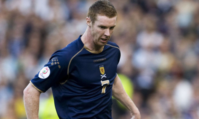 Stephen Pearson in action for Scotland.