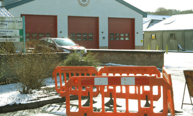 The barriers in Strang Street, with Forfar Fire Station in the background.