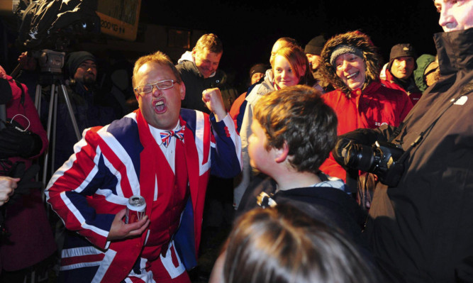 Residents celebrate the results of the referendum in Stanley.