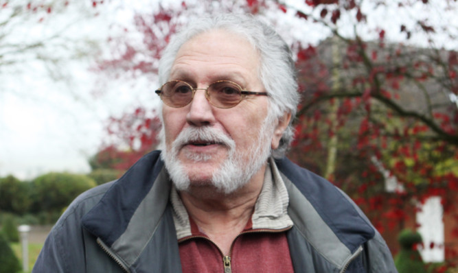 Dave Lee Travis talks to the media outside his home in Mentmore, Friday Nov.16, 2012  (PA PHOTO/Max Nash)