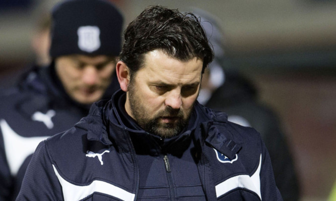 Dundee manager Paul Hartley looks dejected at full-time.
