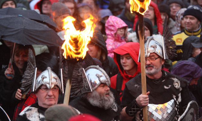 Up Helly Aa members mix with the crowds in Pitlochry.