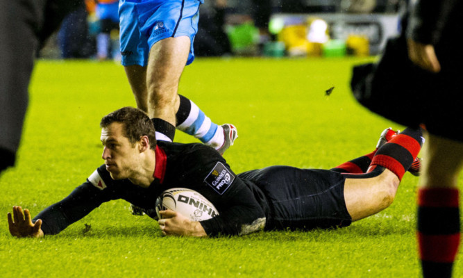 Tim Visser slides in with his and Edinburgh's second try.