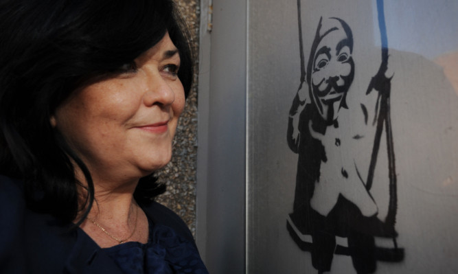 The Brittle Bone Society chief executive Patricia Osborne with the spray-painted image.