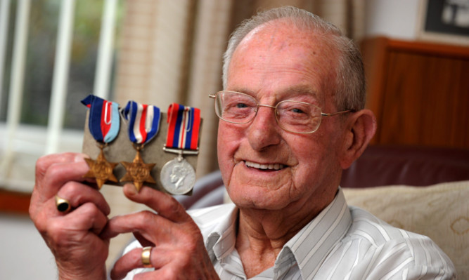 Arthur Grant with his medals.