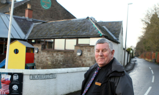 Bar manager Jim Anderson outside the Birkhill Inn, where lead was stolen from the roof.