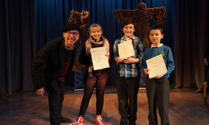 Mr Hegley with (from left) prize winners Iona Byers, Andrew Wells and Jacek Michalowicz.