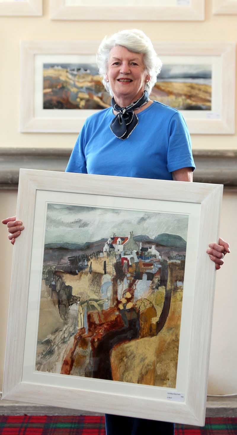 Steve MacDougall, Courier, Duchess Anne Hall, Dunkeld.  40th Dunkeld Cathedral Art Exhibition. Pictured, exhibition chairman Sonja Arbuthnott holdind a piece by artist Liz Myhill entitled 'Corroding Sheep Fanks', with other work by the artist in the background. Liz Myhill is one of the main invited artists along with Peter McDermott. Liz Myhill graduated from Duncan of Jordanstone in 2004.