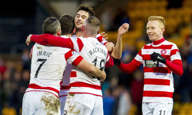 Hamilton's Tony Andreu (second from left) celebrates after giving his side the one goal advantage