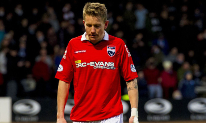 Ross County's Terence Dunfield makes his way to the dressing room after his early red card.