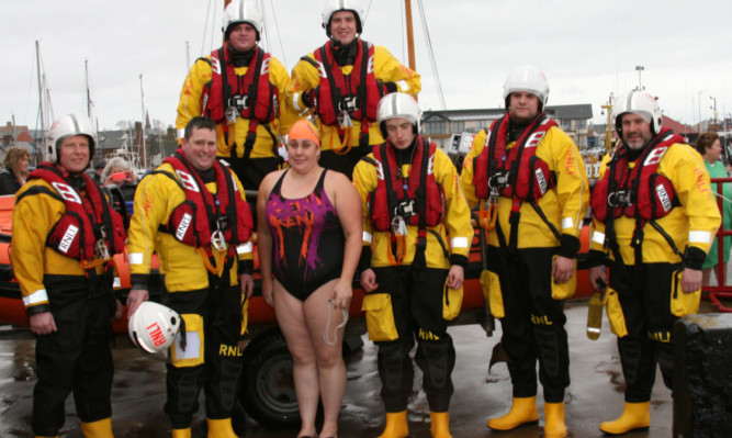 Colleen Blair with members of the Arbroath Lifeboat Crew after the dook in Arbroath.