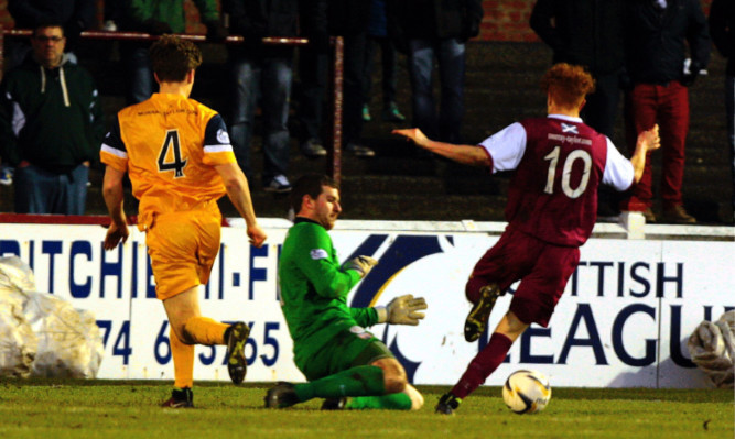 Simon Murray rounds Montrose keeper Stuart McKenzie to score.