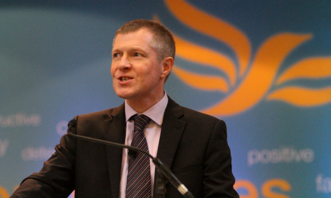 Scottish Lib Dems Leader Willie Rennie addresses the conference in Dundee.