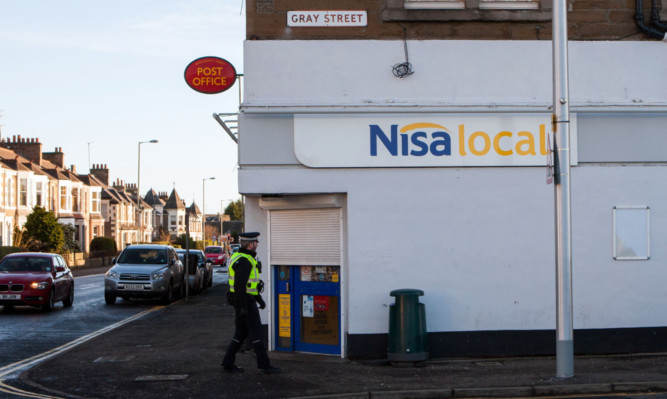 Police locked down the area for three hours following an armed robbery at the Nisa convenience store in Broughty Ferry at the weekend.