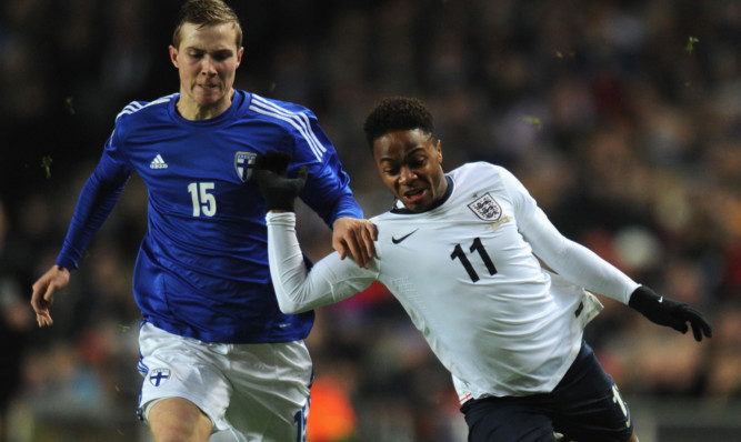 Patrick O'Shaughnessy (left) battles it out with Raheem Sterling.