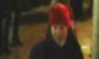 Police would like to interview the man seen here in a red hat and dark coat.