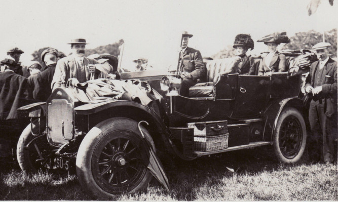 One of the old photos showing the number plate's long history. (Click right arrow for more.)