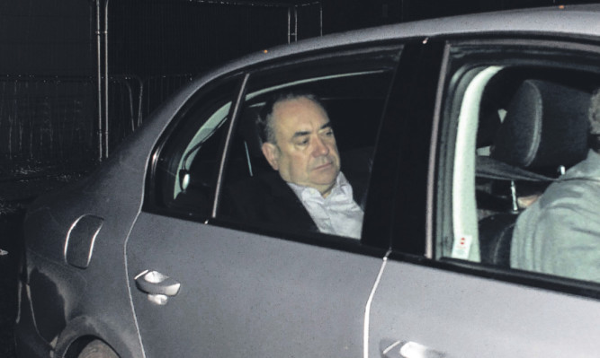 This photo of Alex Salmond was seen as summing up the pain of defeat.