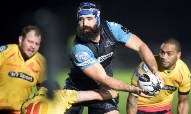 Man of the match and skipper Josh Strauss goes through the Scarlets.