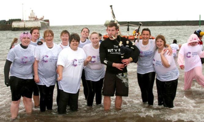 Piper Jack Newth with dookers at Arbroath.