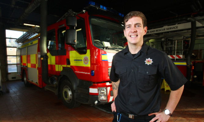 Kris Miller, Courier, 12/01/15. Picture today at Kirkcaldy Fire Station where The Voice star (and firefighter) Stevie McCrorie returned to work after being put through to the next round of the televised show on Saturday night with all four of the judges being impressed by his talents. Pic shows Stevie back at work.