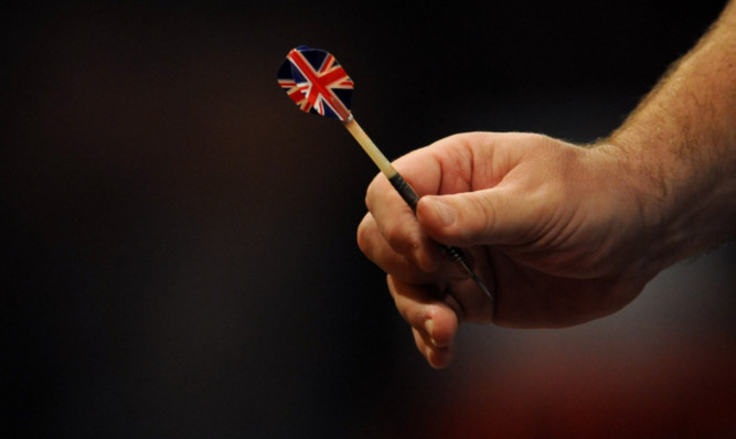 Detailed view of England's Tony O'Shea holding one of his Union Flag flighted darts