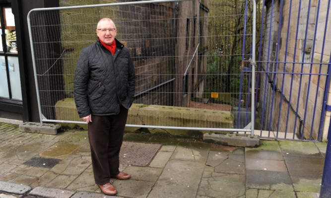 Councillor Bob Young by the area where the new bin store is going to be built, near to the City Chambers and Dunfermline Abbey.