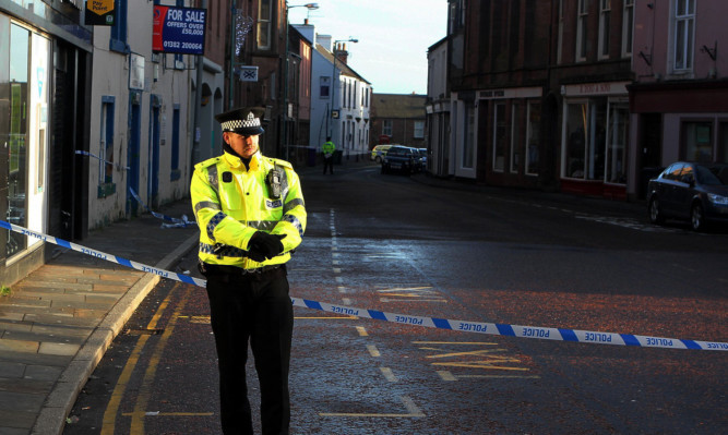 Police at the scene of the cash machine raid in December.