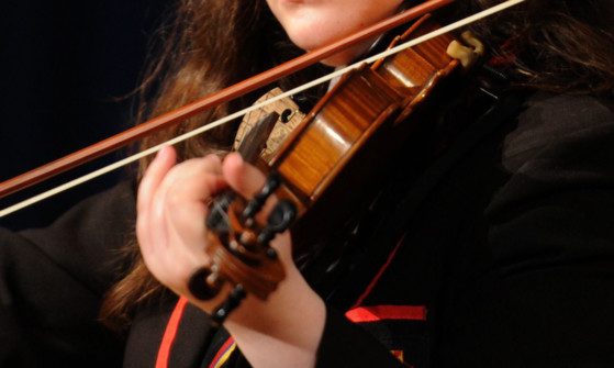 Kim Cessford - 22.09.14 - pictured in Queen Anne High School, Dunfermline where a Peace event was held throughout the day are pupils with a mock United Nations addressing an assembly of S2 pupils - Jennifer Adamson played violin for the assembly