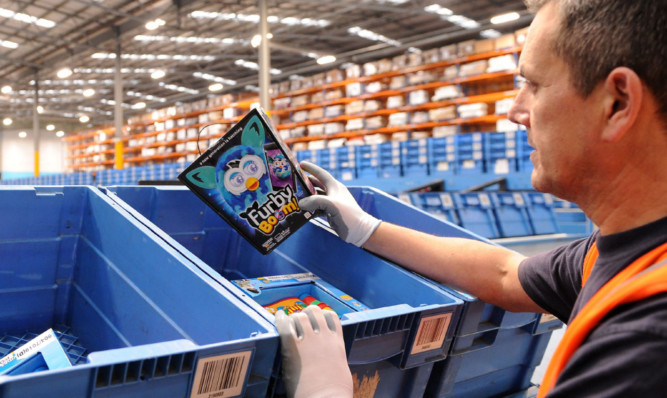 A worker at a major Argos distribution centre. Like-for-like sales for the 18 weeks to January 3 were broadly unchanged at 0.1% higher for the retailer.