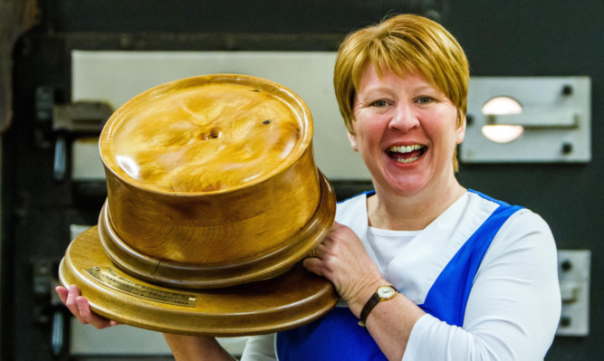 Linda Hill with the world scotch pie champion trophy.