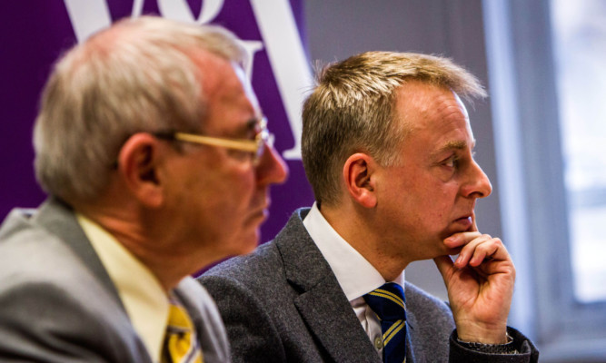 Council leader Ken Guild and V&A at Dundee director Philip Long face the media on Friday. Their tense expressions told a more accurate story than the earlier council press release that glossed over the £31 million hike in the project's cost.