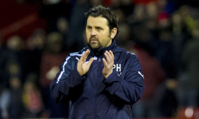 Dundee manager Paul Hartley thanks the travelling fans at Pittodrie