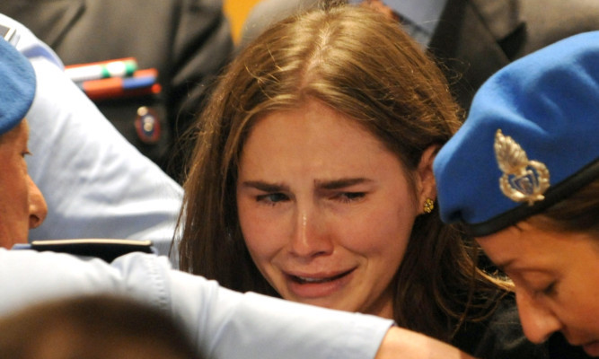 Amanda Knox breaking down in tears after being acquitted of murder and sexual assault in 2011. She now faces the prospect of a retrial.