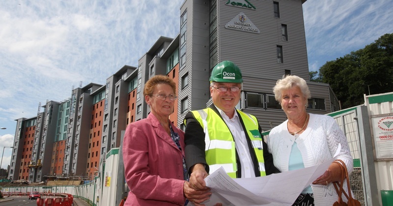 Kris Miller, Courier, 28/06/10, News. Picture today at new Abertay University halls of residence, Dundee. Pic shows L/R, Doris Mays, Bert Mensinga and Wilma Scobie looking over plans of the new building. Doris and Wilma used to stay in the textile tenements that were on the site of the new building.