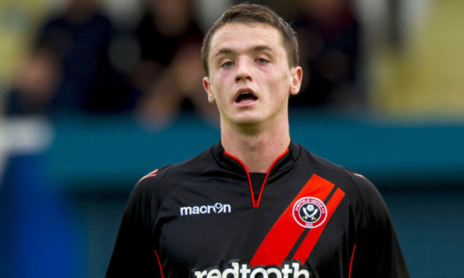 Stephen McGinn in action for Sheffield United