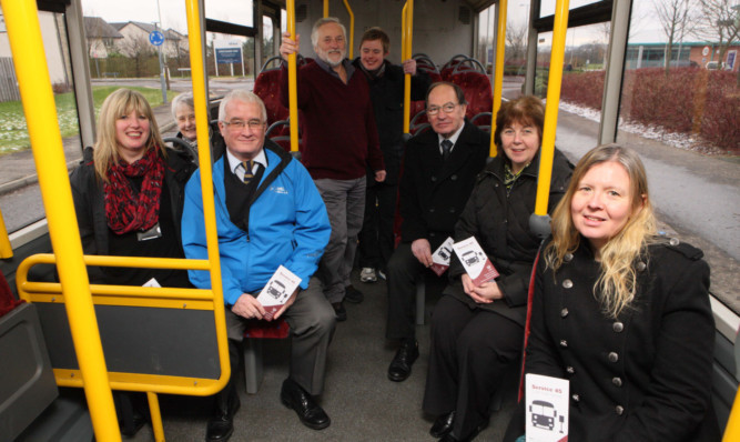 Councillor John Kellas, in blue jacket, with members of the public looking forward to the new bus service.