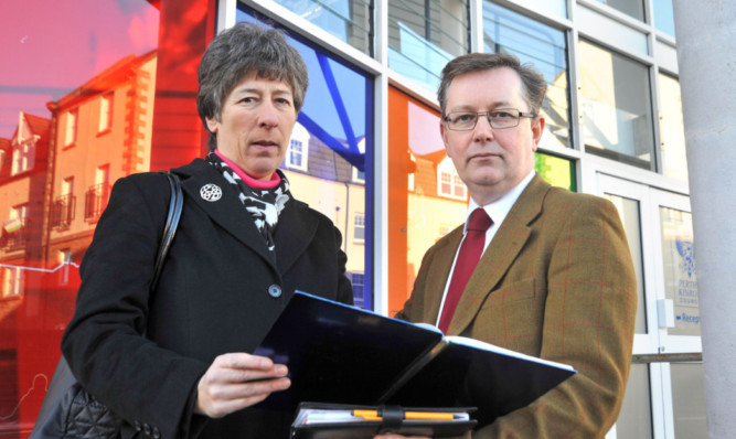 Liz Smith MSP and Councillor Alexander Stewart examine plans for the road that would cut through the Garden of Remembrance.