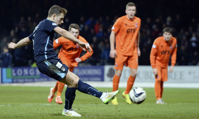 Greg Stewart slots the ball home from the spot to put Dundee 1-0 up