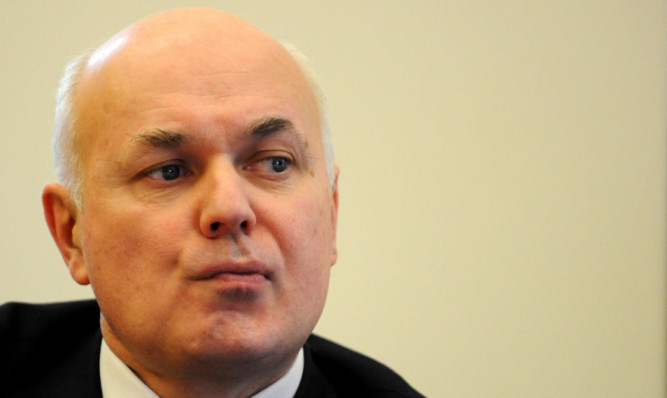 Work and Pensions Secretary Iain Duncan Smith was heckled at a conference in Edinburgh.