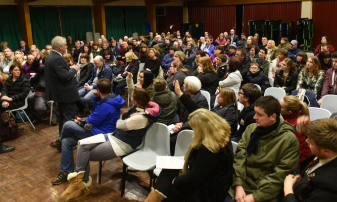 Education chiefs address the large group of parents and children at Menzieshill High School on Thursday night. Picture: Kim Cessford.