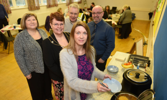 Elsie Turbyne of National Express Dundee, Depute Provost Christina Roberts, Gordon Sharp of Faith in the Community and Pastor Geoff Findlay at the launch of the service.