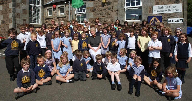 Kris Miller, Courier, 30/06/10, News. Picture today at Balmerino Primary School. Pic shows pupils with Head teacher, Mrs Lesley Blair (seated in centre) who is retiring after 25 years at the school and 42 years teaching.