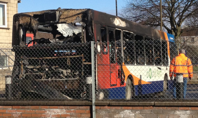 The burned-out bus at Perth station.